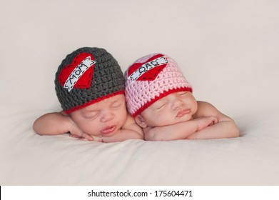 Five Week Old Sleeping Boy And Girl Fraternal Twin Newborn Babies. They Are Wearing Crocheted 