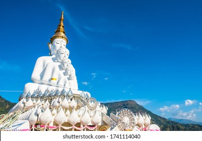 Five white amazing beautiful figure Buddha statues, small to big with the blue sky background. Photos at Wat Pha Sorn Kaew, Khao Kor, Phetchabun, Thailand, Buddhist monastery and public temple.