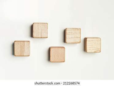 Five wood blocks in the white background.