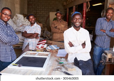 Five workers in a carpentry workshop, portrait, South Africa