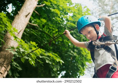 Five year boy on rope-way in the forest - Powered by Shutterstock