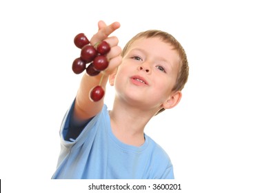 five years old boy and fresh cherries isolated on white