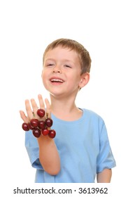 five years old boy and fresh cherries isolated on white