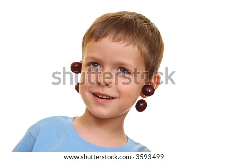 five years old boy and fresh cherries isolated on white
