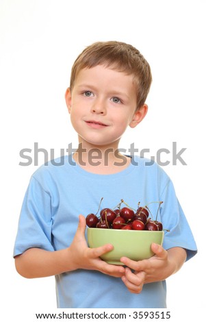 five years old boy and fresh cherries isolated on white