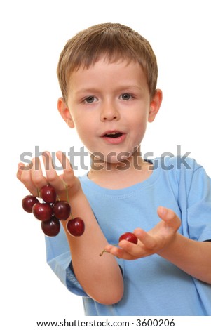 five years old boy and fresh cherries isolated on white