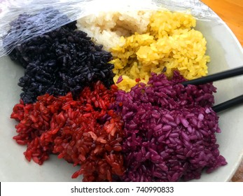 Five-colored glutinous rice, a traditional festival food for the Zhuang ethnic group in southwest of China. Natural healthy plants and fruits are minced to dye the rice into different colors.