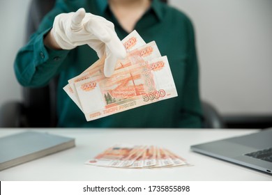 Five-thousand-ruble Bills In Gloves. Payments In The Context Of A Pandemic. Money On The Internet Online. NCOV-19 Coronavirus