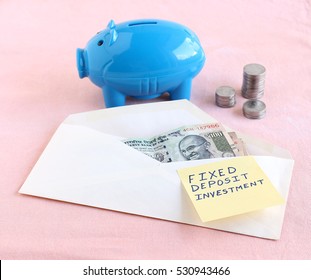 Fixed Deposit Investment Concept, Indicated Handwritten Text On A Paper On An Envelope With Indian Rupees.