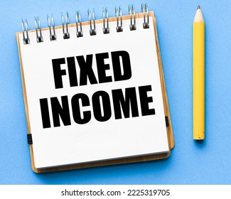 FIXED INCOME words in an office notebook. - Shutterstock ID 2225319705