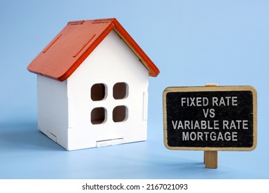 Fixed rate vs variable rate mortgage. Model of the house and a sign next to it. - Shutterstock ID 2167021093