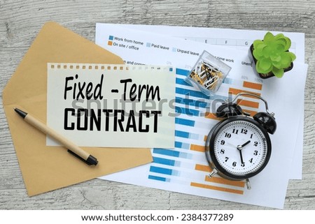 Fixed Term Contract envelope with text on the page. a table clock
