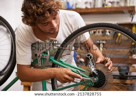 Fixing things is what I do best. Shot of a confident young bicycle repairman.