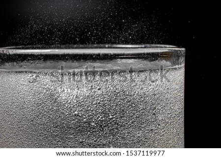Fizz sparkling water Refreshing bubbly Soda Pop with Ice Cubes. Cold soft drink carbonated liquid fresh and cool iced drink in a glasses . Refreshing and quench thirst concept .