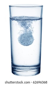 Fizzy Pill In The Glass Of Water. Isolated On A White Background.