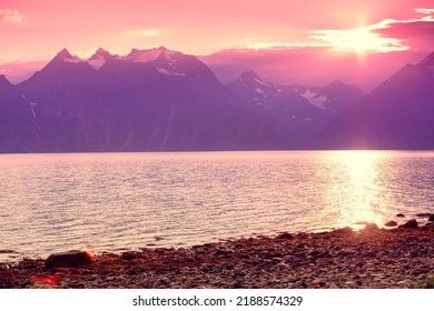 Fjord and rocks during sunset. Rocky seashore in the evening.  Beautiful nature of Norway. Picturesque Scandinavian landscape. Norway, Europe - Powered by Shutterstock