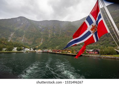 Fjord Village Flam in Aurland with Norway Flag