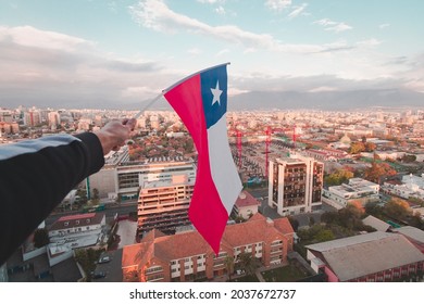 Chilean’s flag above Santiago city