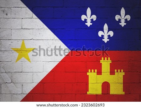 Flag of Acadiana painted on a cinder block wall.