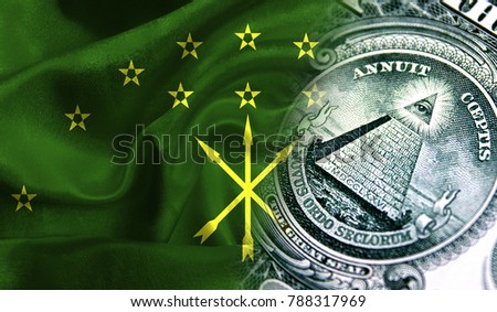 Flag of Adygea on a fabric with an American dollar close-up.
