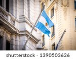 
Flag of the agentina in the midst of the old city building - Image