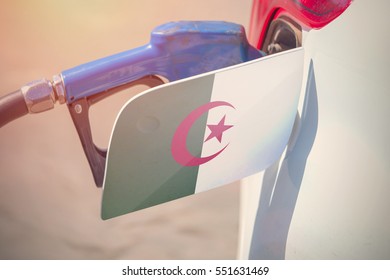 Flag Of Algeria On The Car's Fuel Filler Flap With Gas Pump Nozzle In The Tank