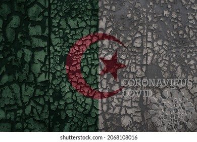 Flag Of Algeria On A Old Vintage Metal Rusty Cracked Wall With Text Coronavirus, Covid, And Virus Picture.