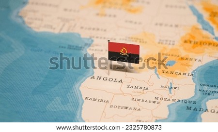 The Flag of Angola on the World Map.