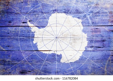 Flag of Antarctica painted on grungy wood plank background