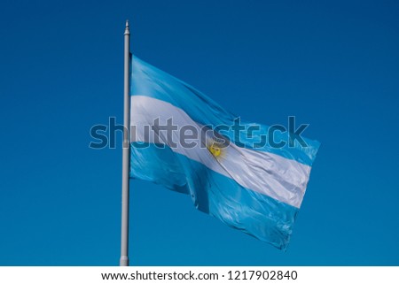 The flag of Argentina (Bandera argentina - Bandera Nacional) is a horizontal triband of light blue (top and bottom) and white with the Sun of May centered on the white band. Buenos Aires, Argentina
