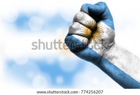 Flag of Argentina painted on male fist