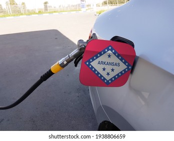 Flag Of Arkansas On The Car's Fuel Tank Filler Flap. Petrol Station. Fueling Car At A Gas Station.