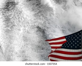 Flag behind a boat shown with wake