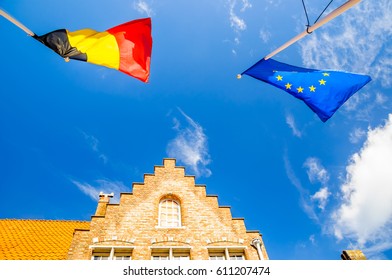 Flag of Belgium and EU in Bruge in the wind