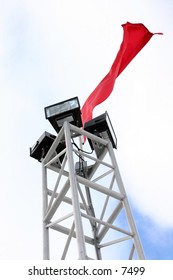 flag blowing on tower lights