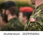 Flag of Canada on the military uniform. Canadian soldiers. Army of Canada. Remembrance Day. Canada Day. 