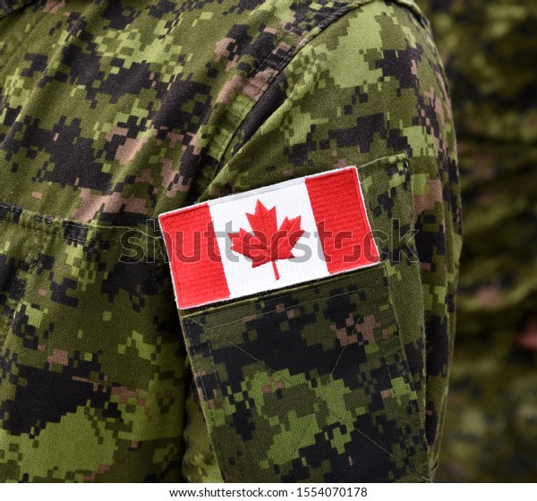 Flag of Canada on military
uniform. Canadian soldiers. Army of Canada. Remembrance Day. Canada
Day.