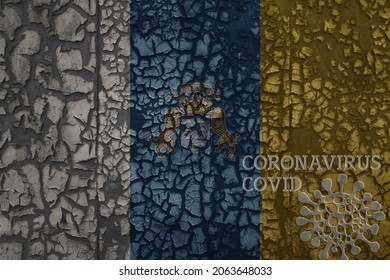 Flag Of Canary Islands On A Old Vintage Metal Rusty Cracked Wall With Text Coronavirus, Covid, And Virus Picture.