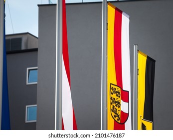  Flag of Carinthia, or Karntern, waiving in front of flag of the city of Villach and flag of Austria. Carinthia, or karnten in German, it's an Austrian land, province of southeastern Austria, in alps