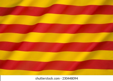 Flag of Catalonia - The Senyera. This flag, often called bars of Aragon, historically represented the King of the Crown of Aragon. Catalonia is a region of Spain.