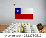 Flag of Chile with Pills and Capsules. Pharmaceutical Concept 