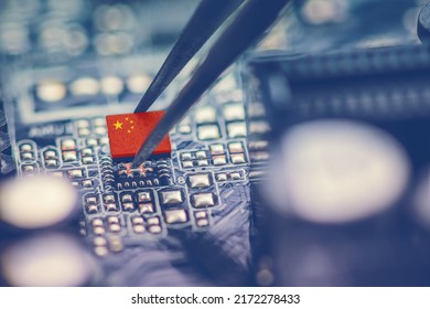 Flag of China on a processor, CPU Central processing Unit or GPU microchip on a motherboard. China is world's largest chip manufacturer, demonstrating the country's superiority in global supply chain. - Shutterstock ID 2172278433