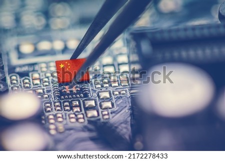 Flag of China on a processor, CPU Central processing Unit or GPU microchip on a motherboard. China is world's largest chip manufacturer, demonstrating the country's superiority in global supply chain.