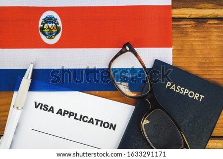 Flag of Costa Rica , visa application form and passport on table