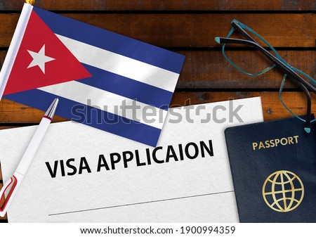 Flag of Cuba , visa application form and passport on table