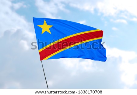 Flag of DR Congo in front of blue sky