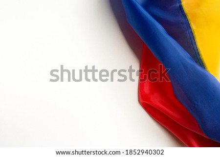 flag of ecuador, venezuela, colombia wrinkled placed on a white background on the right diagonal side
