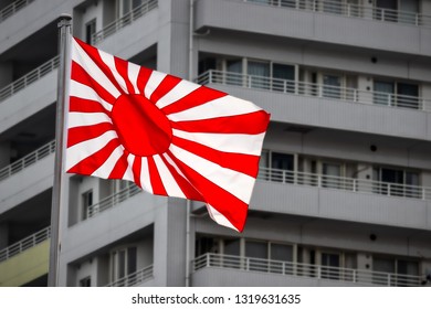 The Flag, Or Ensign, Of The Imperial Japanese Navy Waving In The Wind.