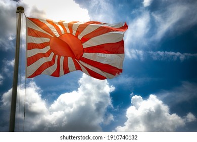 The Flag, Or Ensign, Of The Imperial Japanese Navy Waving In The Wind.