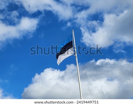 The flag of Estonia is a tricolour flag consisting of three equal horizontal bands of blue, black, and white, symbolizing freedom and national identity in the European country of Estonia.